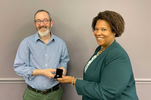 Dr. Jackson presents Philosophy Donald Turner with an award