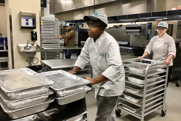 Photo of Culinary students providing Thanksgiving meals