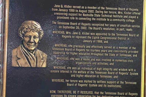 Photo of Jane Kisber plaque on Library named for her