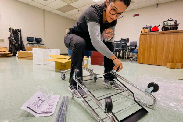 Photo of Perl Cohn High School Students setting up lab