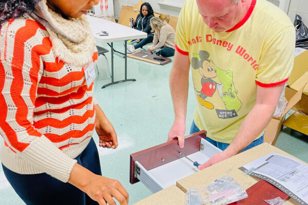 Photo of Perl Cohn High School Students setting up lab