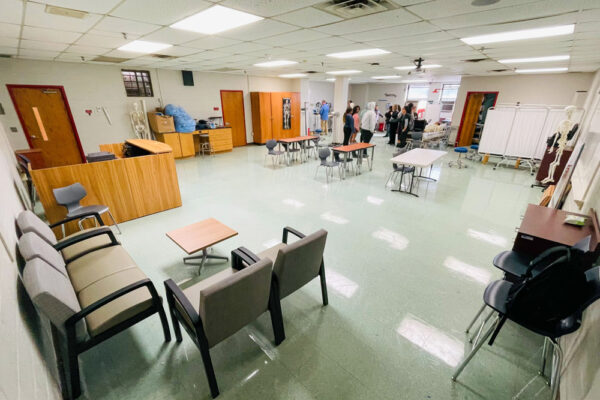 Photo of Perl Cohn High School Students setting up lab