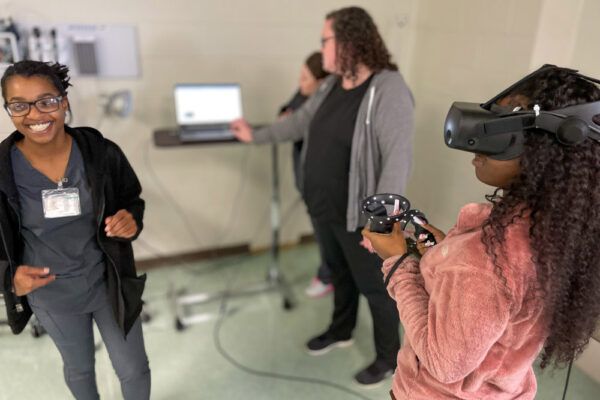 Photo of Perl Cohn High School Students experiencing Periop Sim VR technology