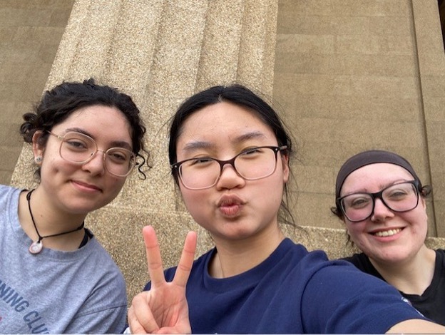 Three students, Damari Ornelas, Phuc Tran, and Amanda McCarthy pose and smile for the camera.