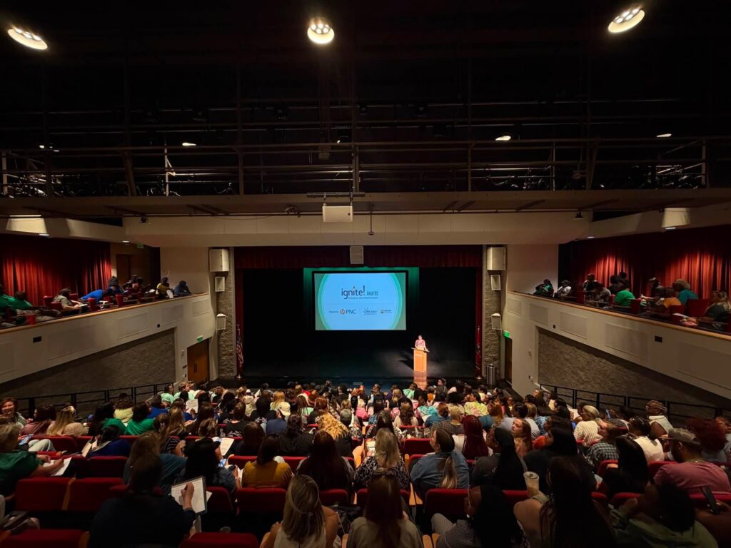 Elandriel Lewis welcomes attendees to the IGNITE Conference.